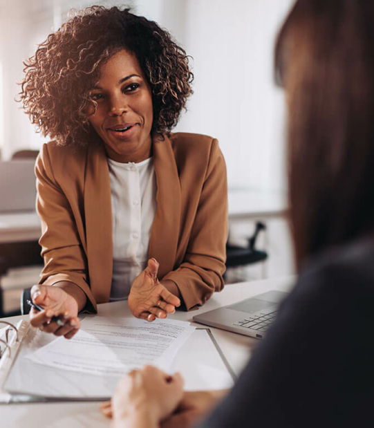 Professional financial advisor presenting recommendations to her client