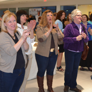 Audience applauding at Raise the Region ceremony, celebration the gifts of financial giving